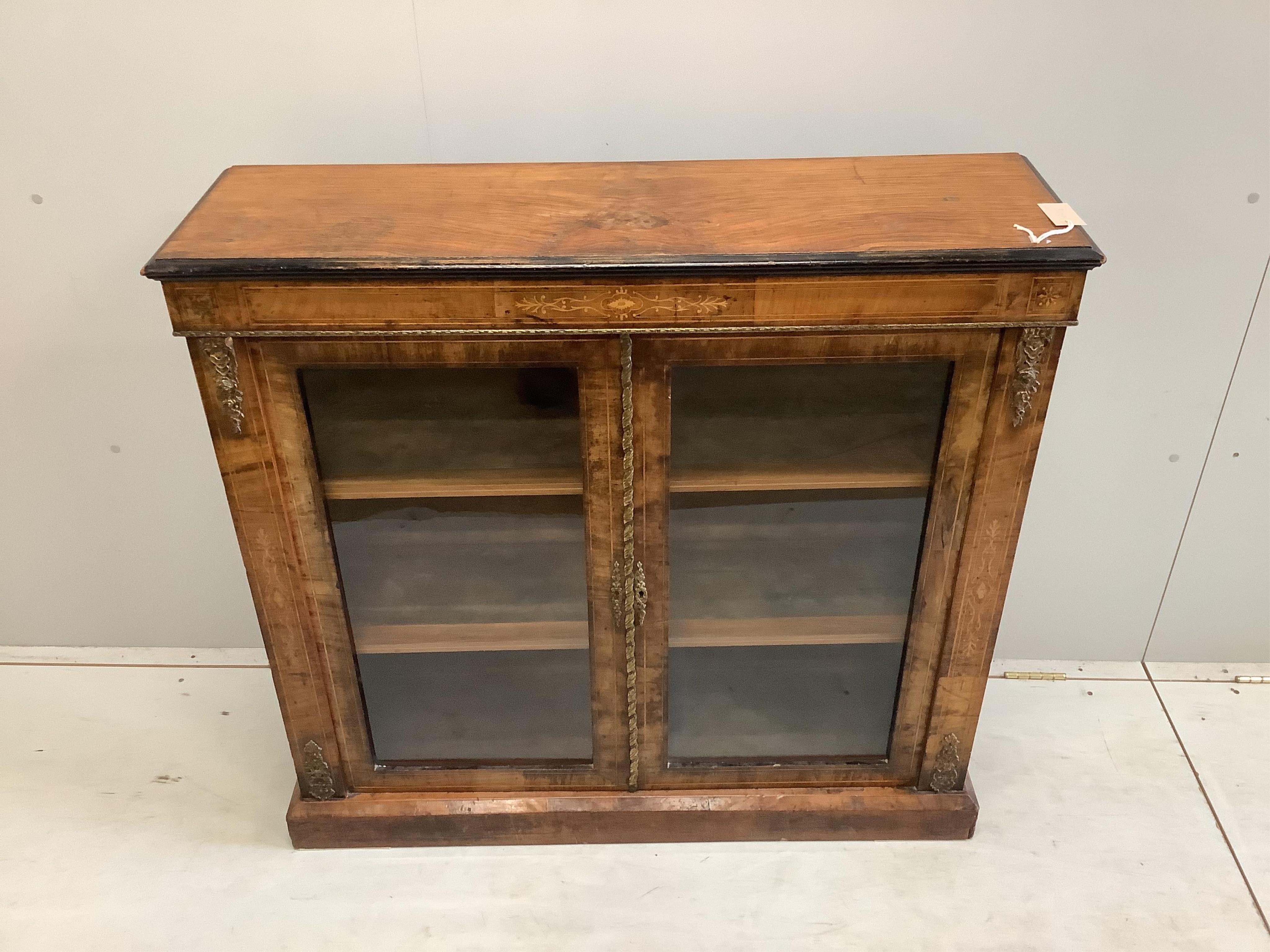 A late Victorian gilt metal mounted inlaid walnut pier cabinet, width 106cm, depth 31cm, height 99cm. Condition - fair